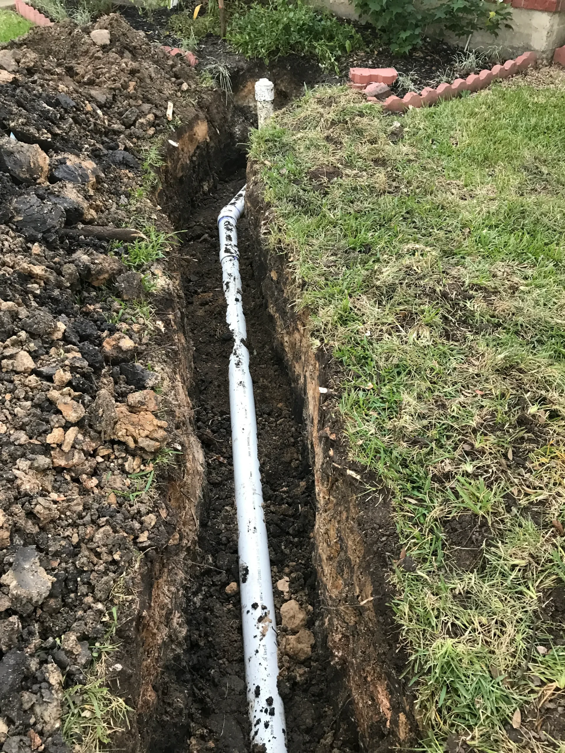digging trench for sewer line in 2026